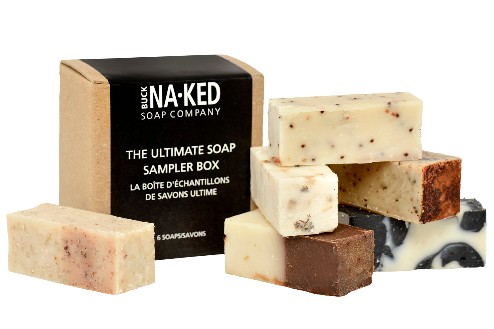 Collection of buck NAKED soap bars with a sampler box on a white background