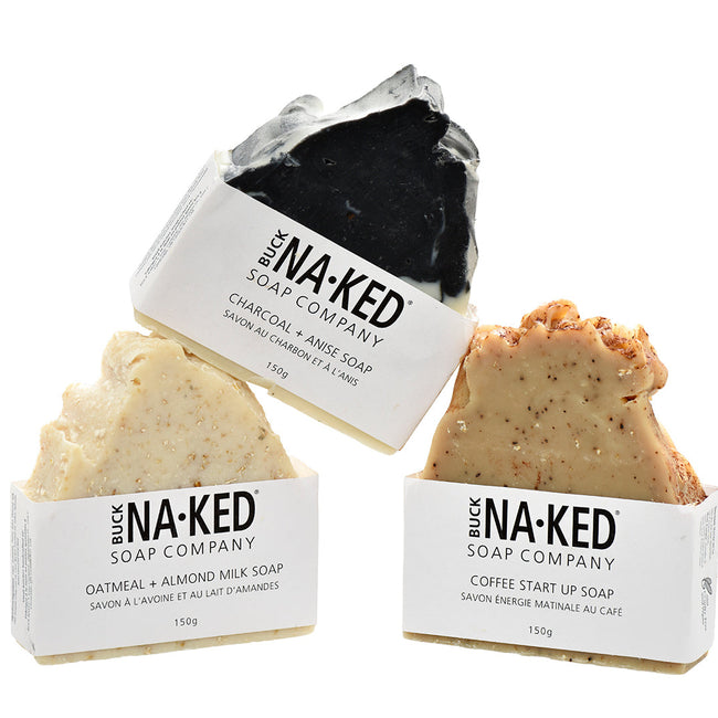 Three soaps from the Buck NaKed Soap Company on a white background