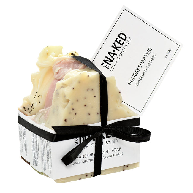 Three soaps in a box with a black ribbon and 'Naked Soap Company' label on a white background.