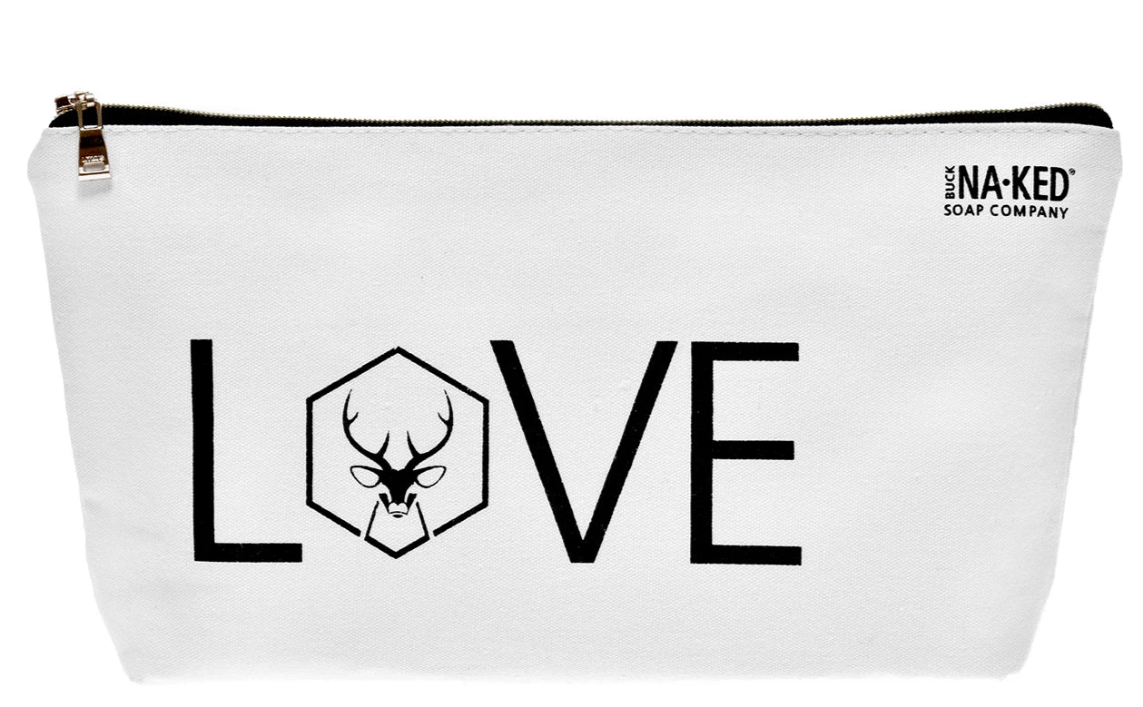 white toiletries bag with the word love